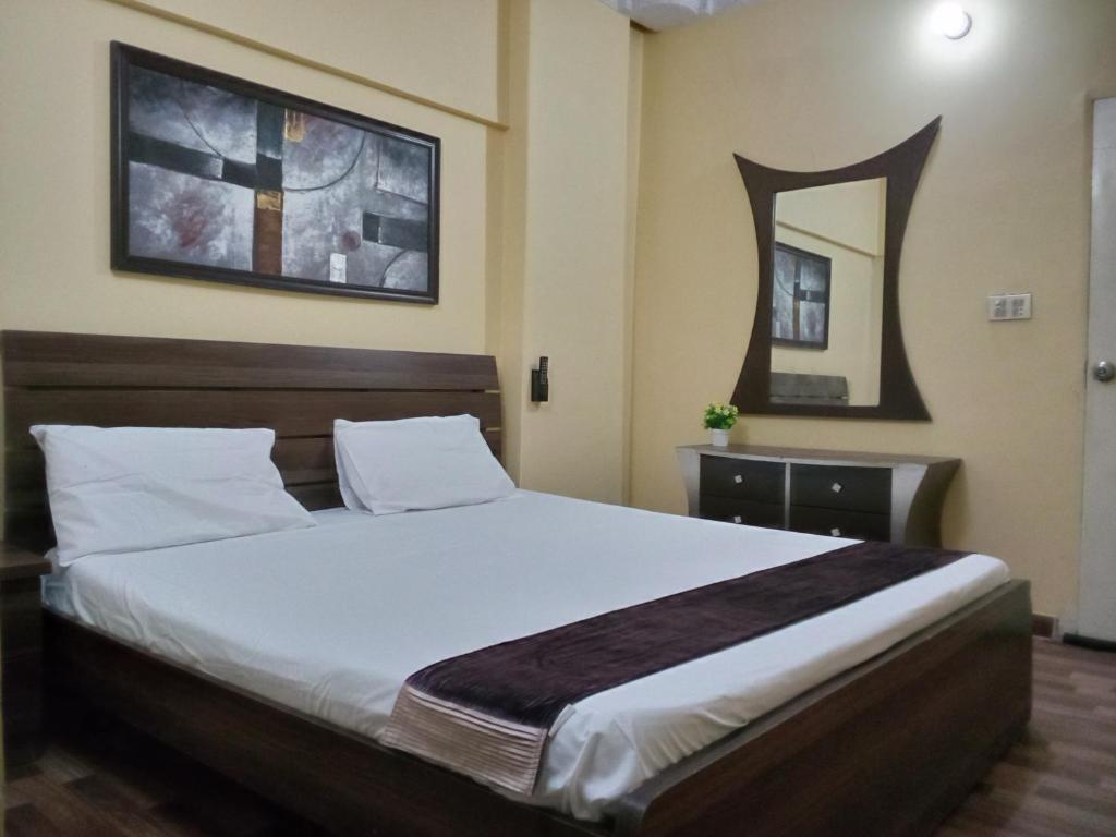a bedroom with a large white bed in a room at Furnished One Bed Room Apartment Ground Floor With Kitchen in Karachi