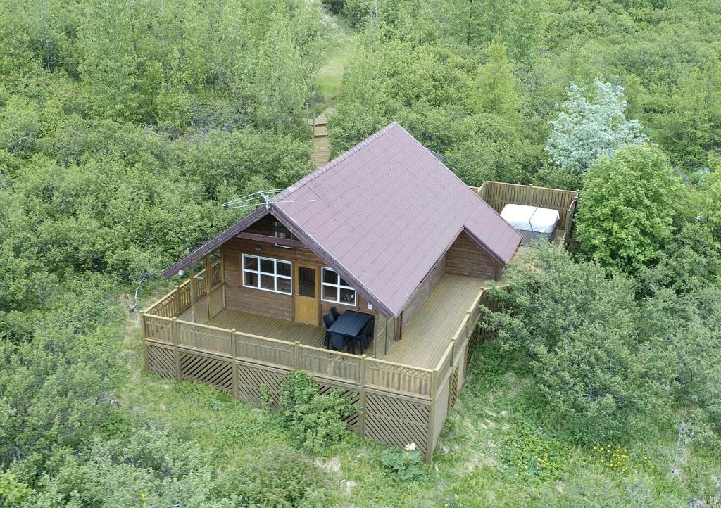 an overhead view of a house with a purple roof at Cozy Cottage in Icelandic nature with Hot tub in Akranes
