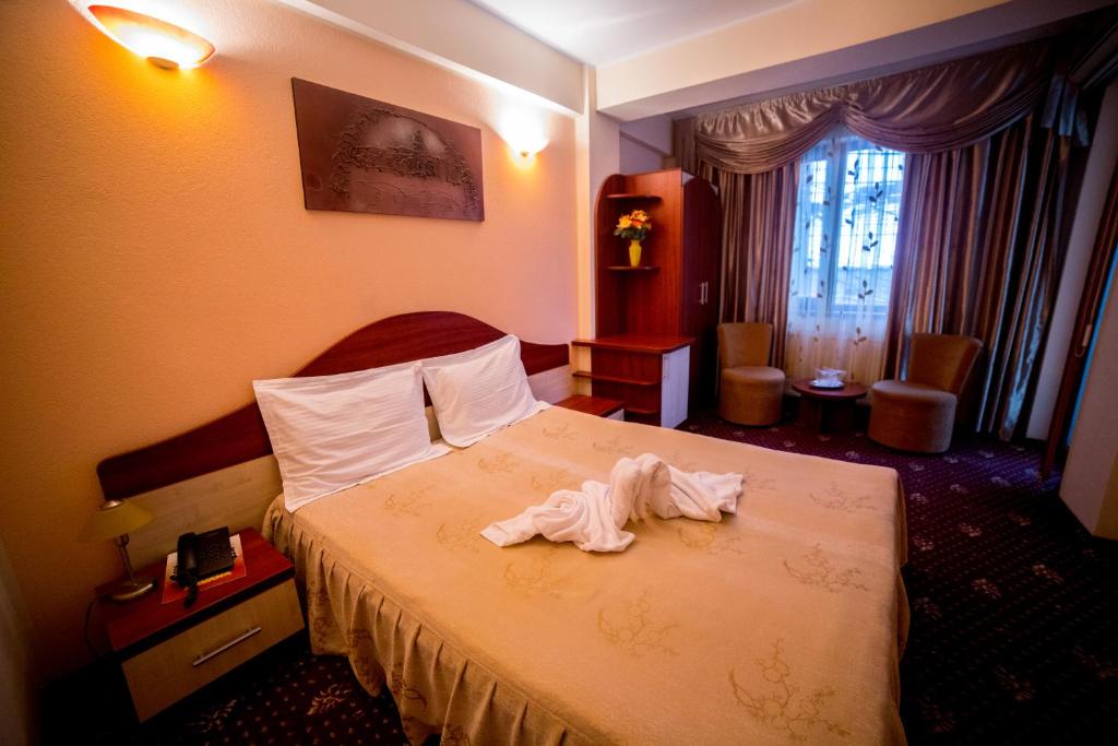 Postel nebo postele na pokoji v ubytování Hotel Havana