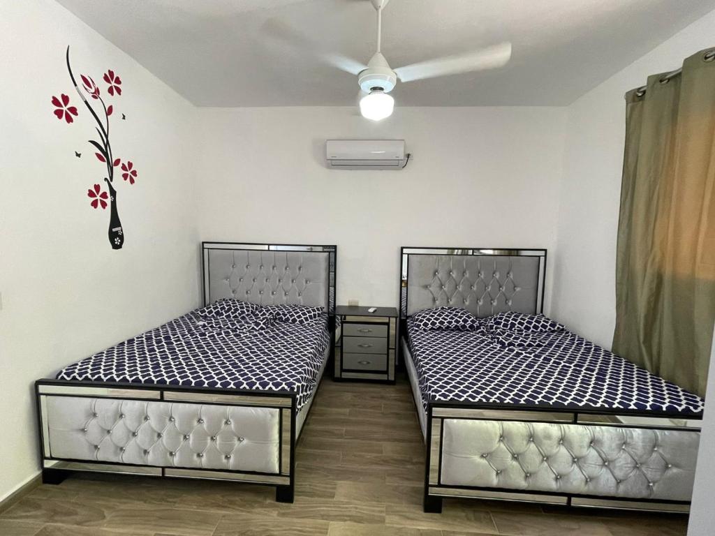 Postel nebo postele na pokoji v ubytování Villa Flor 2022