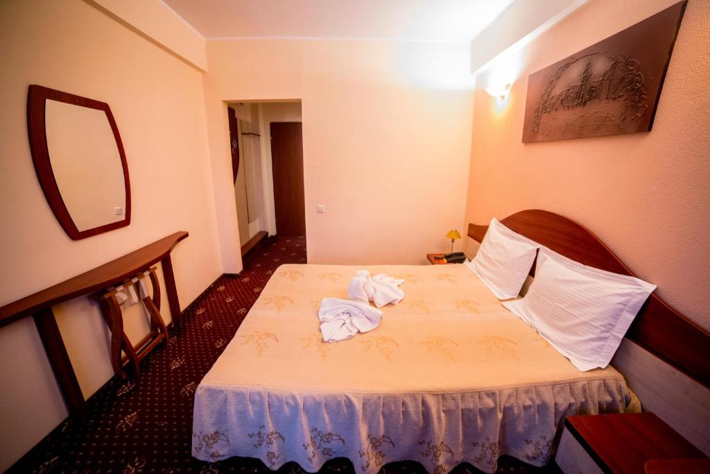 Postel nebo postele na pokoji v ubytování Hotel Havana