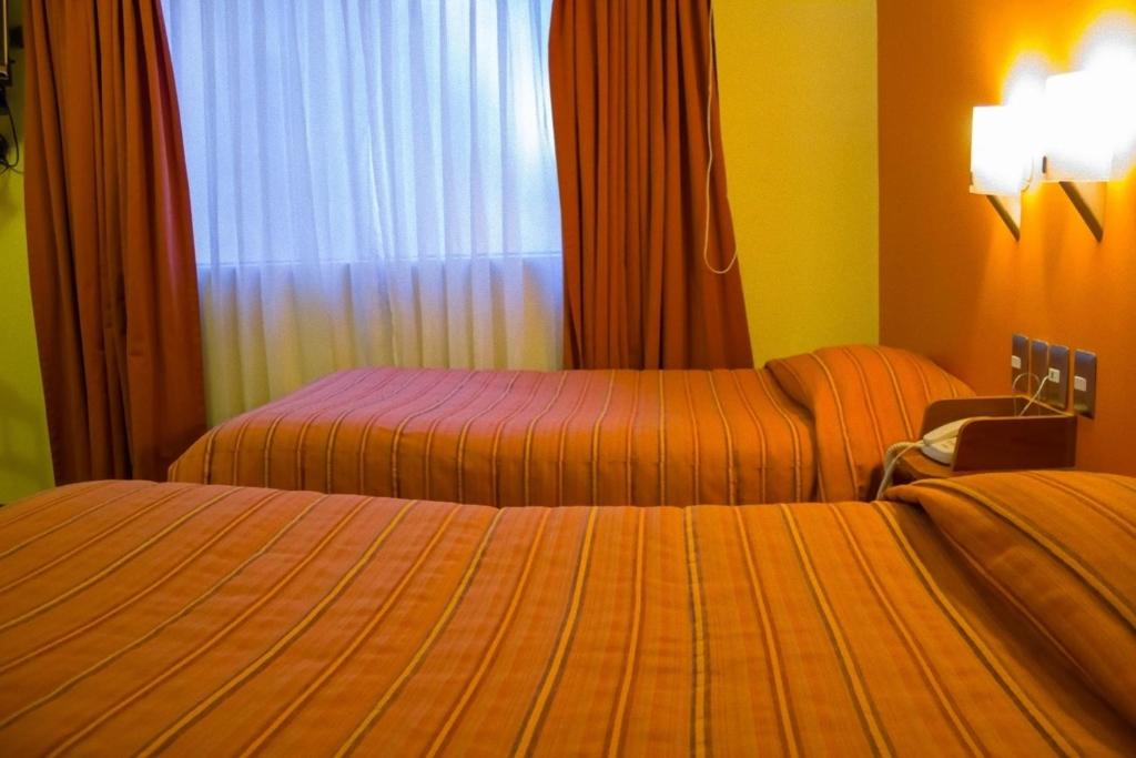 Postel nebo postele na pokoji v ubytování Mosoq Inn