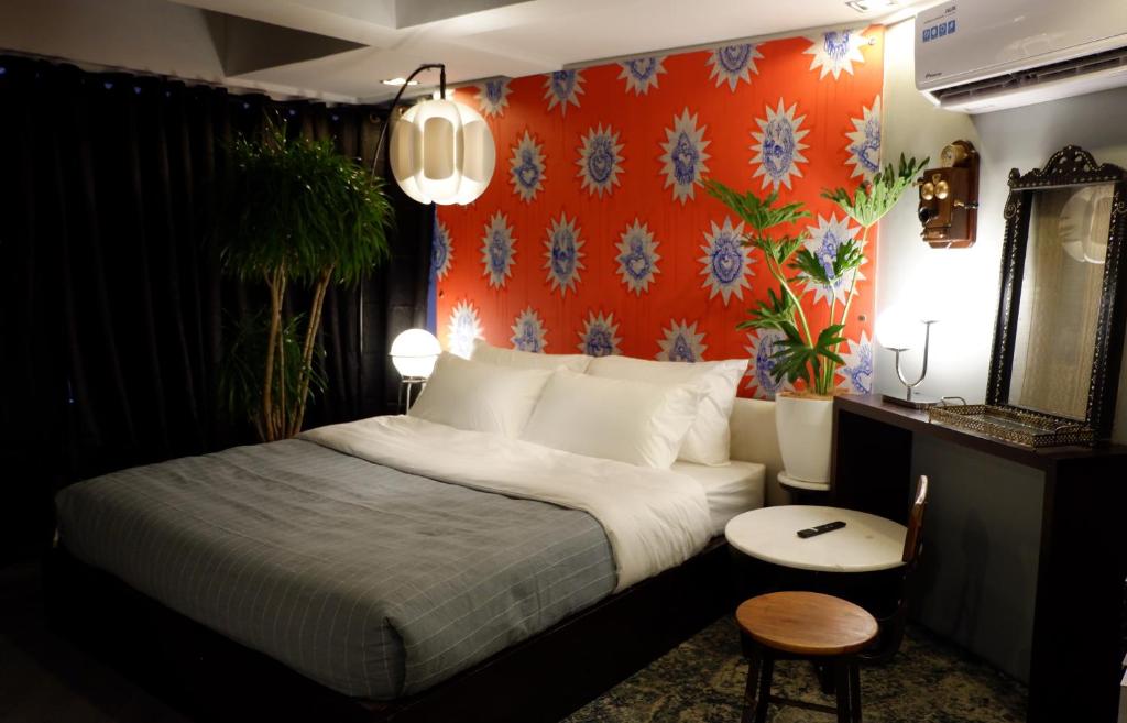 Postel nebo postele na pokoji v ubytování Havitat Boutique Hotel