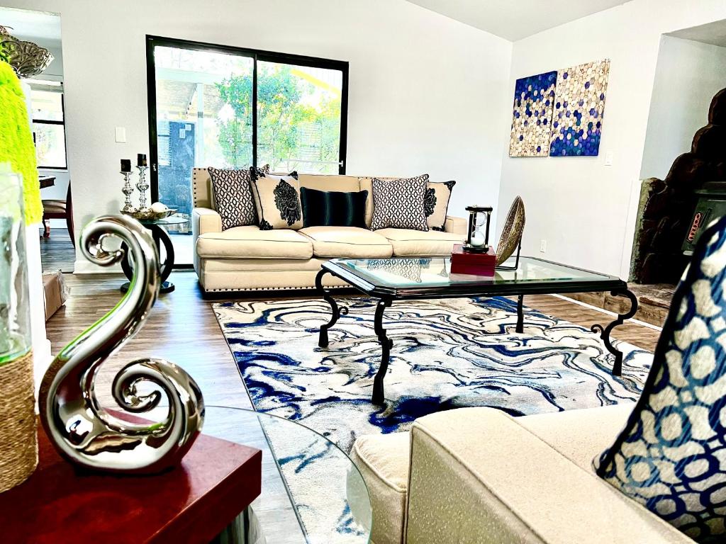 a living room with a couch and a table at Luxurious Bungalow in Payson in Payson