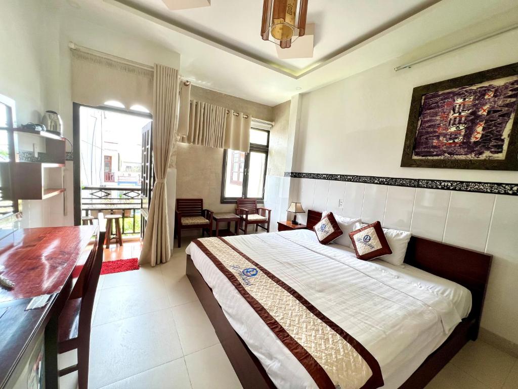 Postel nebo postele na pokoji v ubytování Hoi An Ngo Homestay