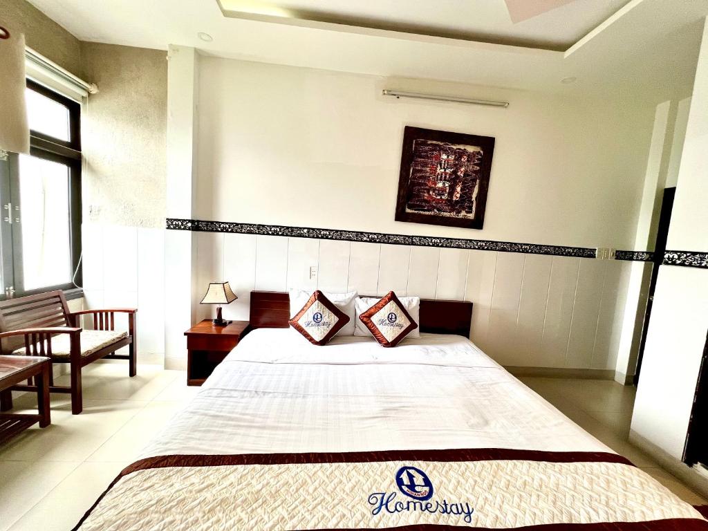 Postel nebo postele na pokoji v ubytování Hoi An Ngo Homestay