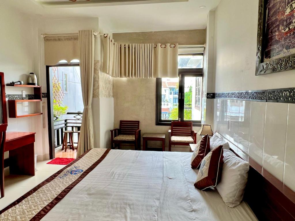 Postel nebo postele na pokoji v ubytování Hoi An Ngo Homestay
