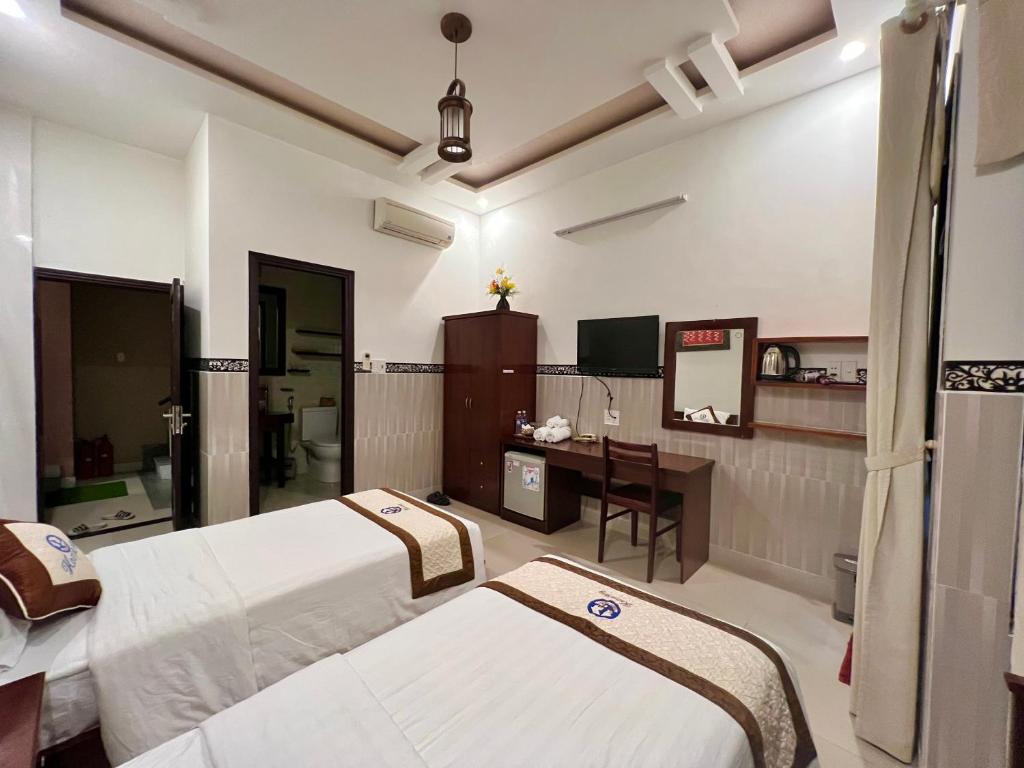 Postel nebo postele na pokoji v ubytování Hoi An Ngo Homestay