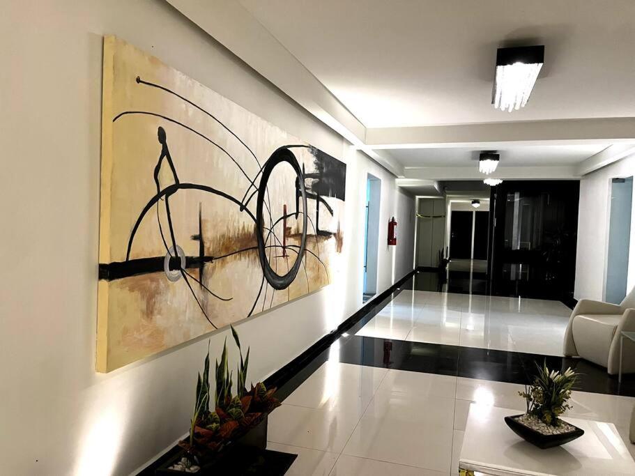 a living room with a painting on the wall at Apartment in the touristic heart of Mexico City in Mexico City