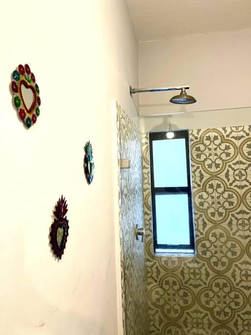 a bathroom with a window on the wall at Apartment in the touristic heart of Mexico City in Mexico City