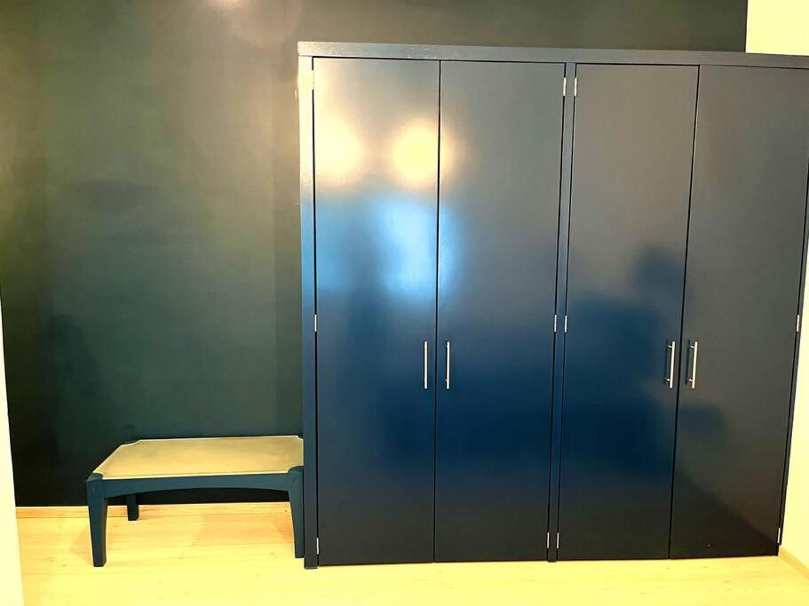 a blue cabinet with a bench next to it at Apartment in the touristic heart of Mexico City in Mexico City