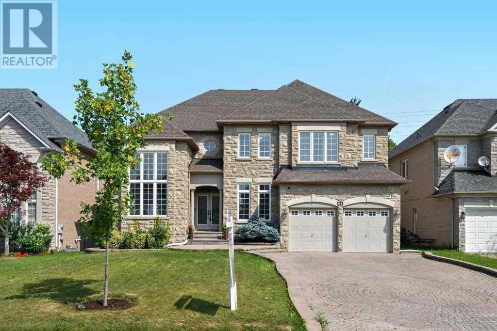 a house with a driveway in front of it at Rooms in Luxury Vaughan Home in Vaughan