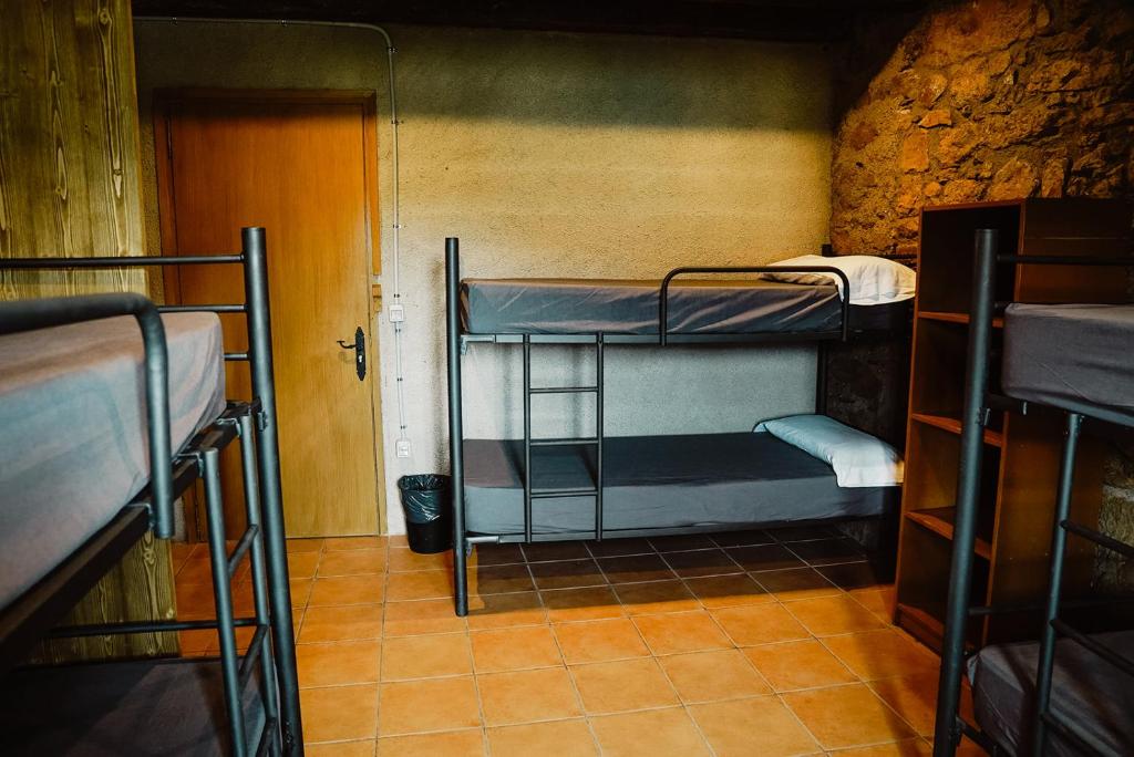 Postel nebo postele na pokoji v ubytování Cases Altes de Posada