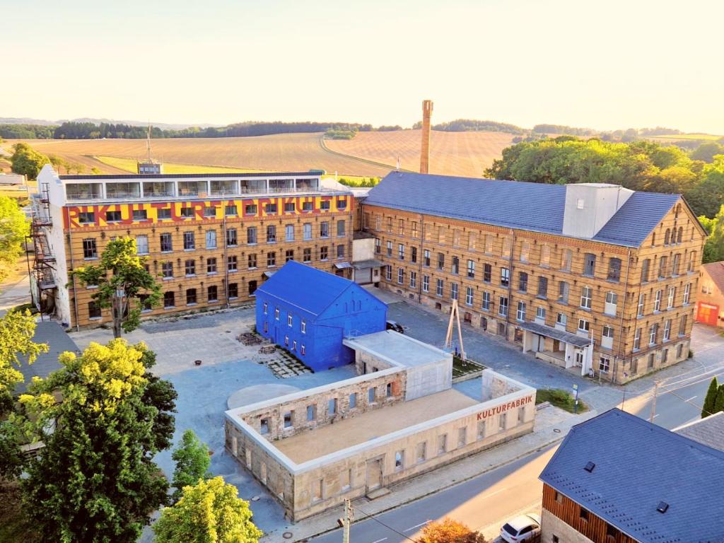 an overhead view of a large brick building at Kulturfabrik Schönbach in Schönbach