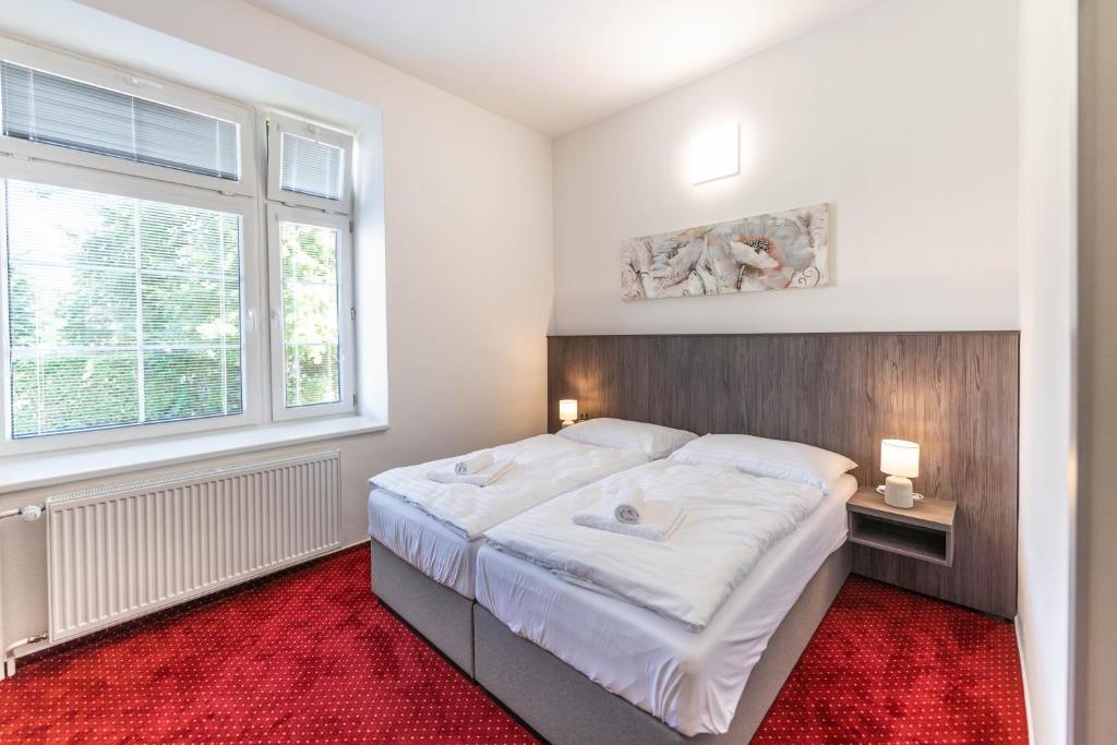 Postel nebo postele na pokoji v ubytování Hotel Orka
