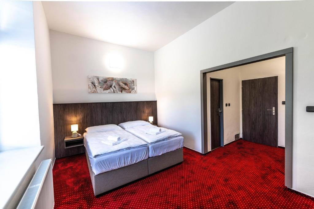 Postel nebo postele na pokoji v ubytování Hotel Orka