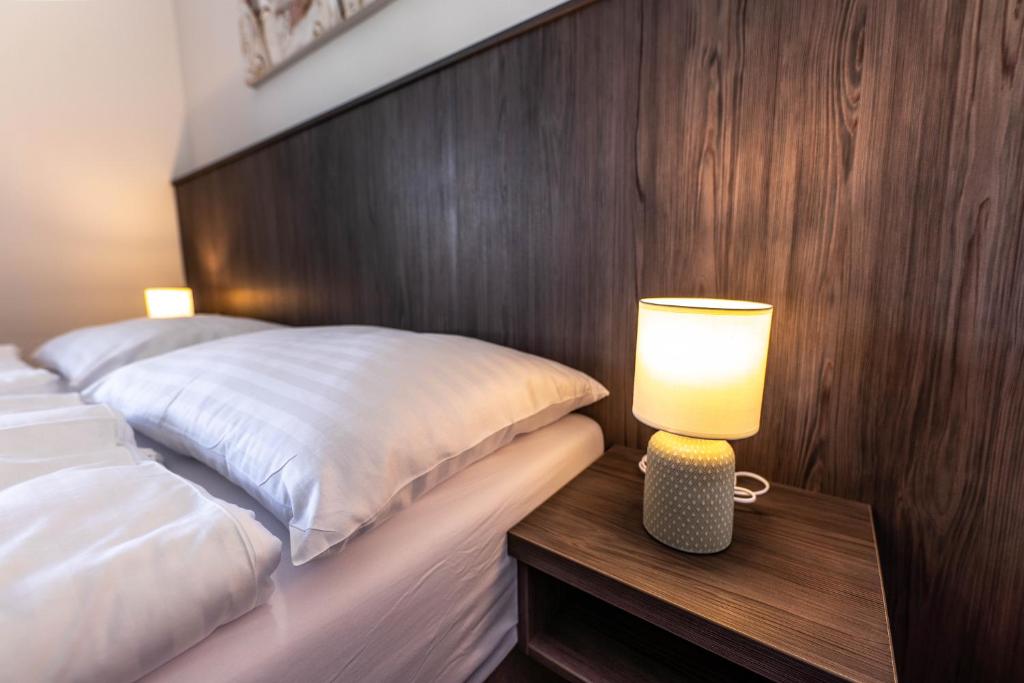 Postel nebo postele na pokoji v ubytování Hotel Orka