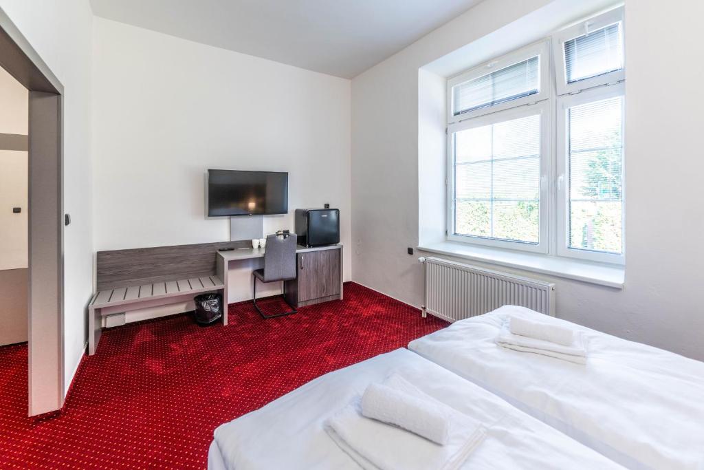Postel nebo postele na pokoji v ubytování Hotel Orka