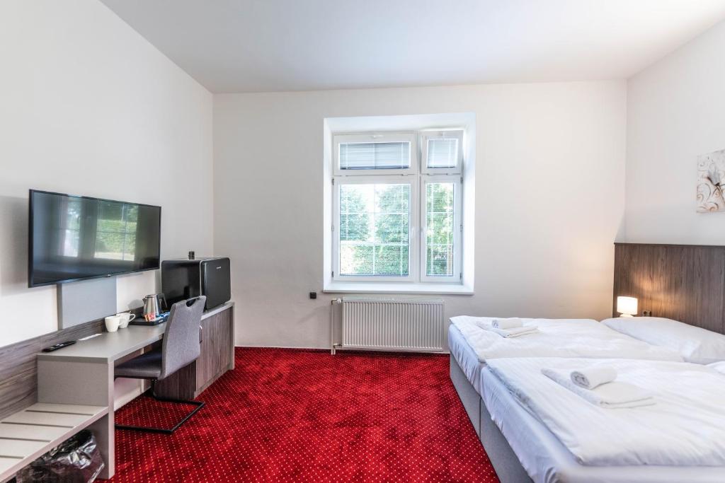 Postel nebo postele na pokoji v ubytování Hotel Orka
