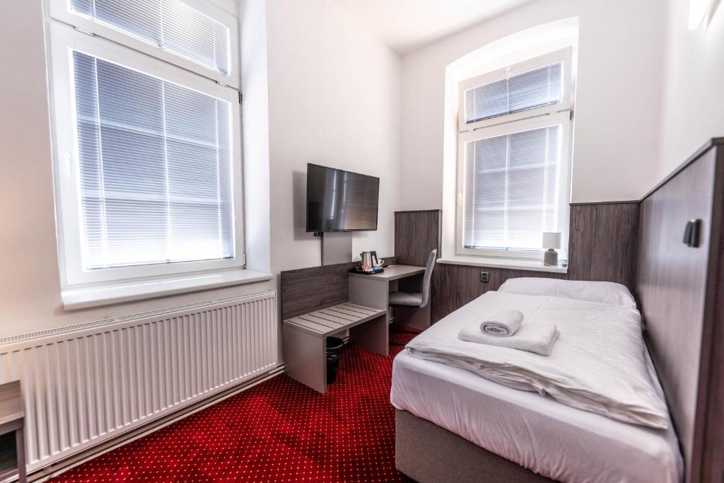 Postel nebo postele na pokoji v ubytování Hotel Orka