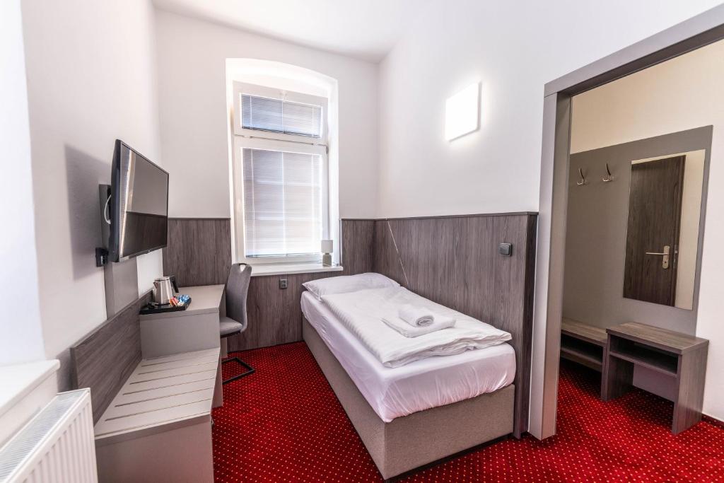 Postel nebo postele na pokoji v ubytování Hotel Orka