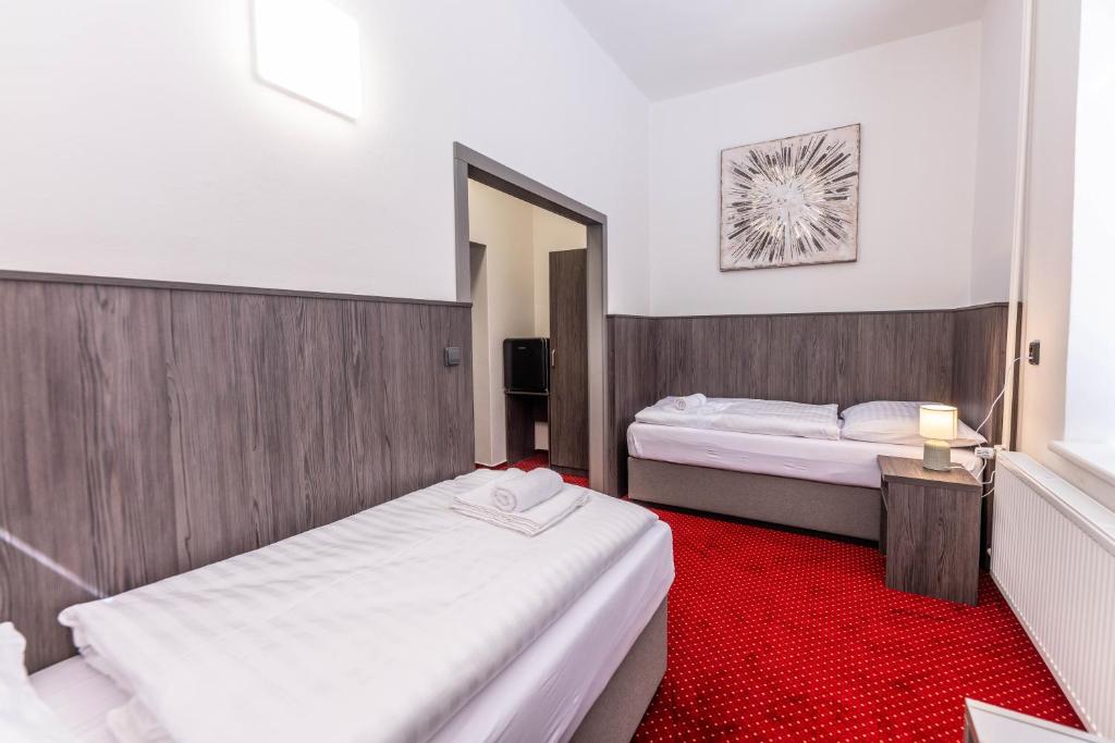 Postel nebo postele na pokoji v ubytování Hotel Orka