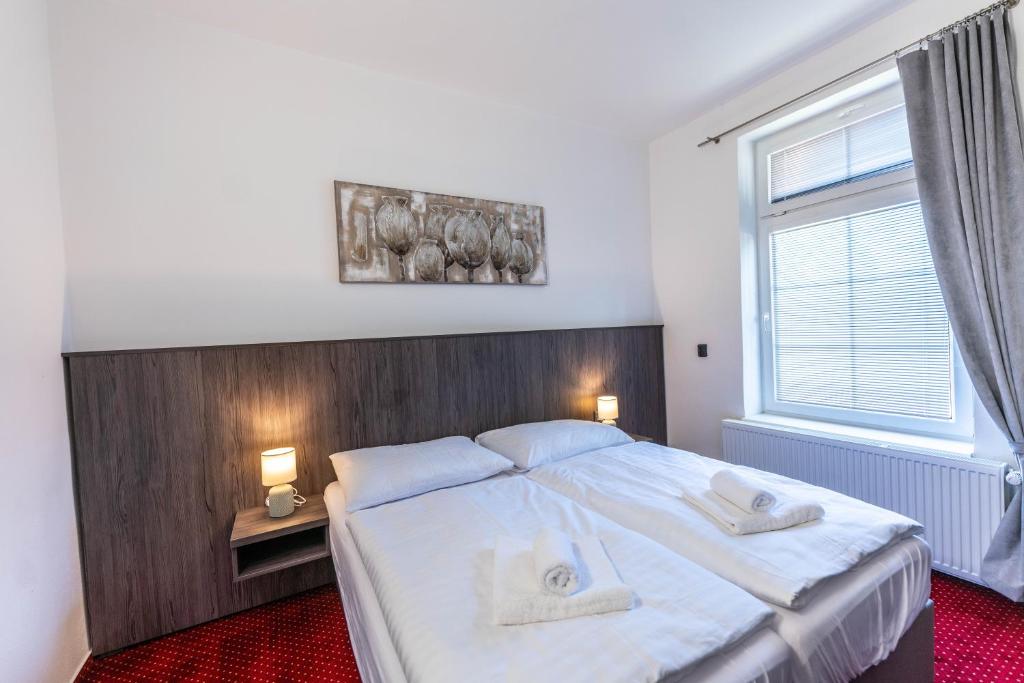 Postel nebo postele na pokoji v ubytování Hotel Orka