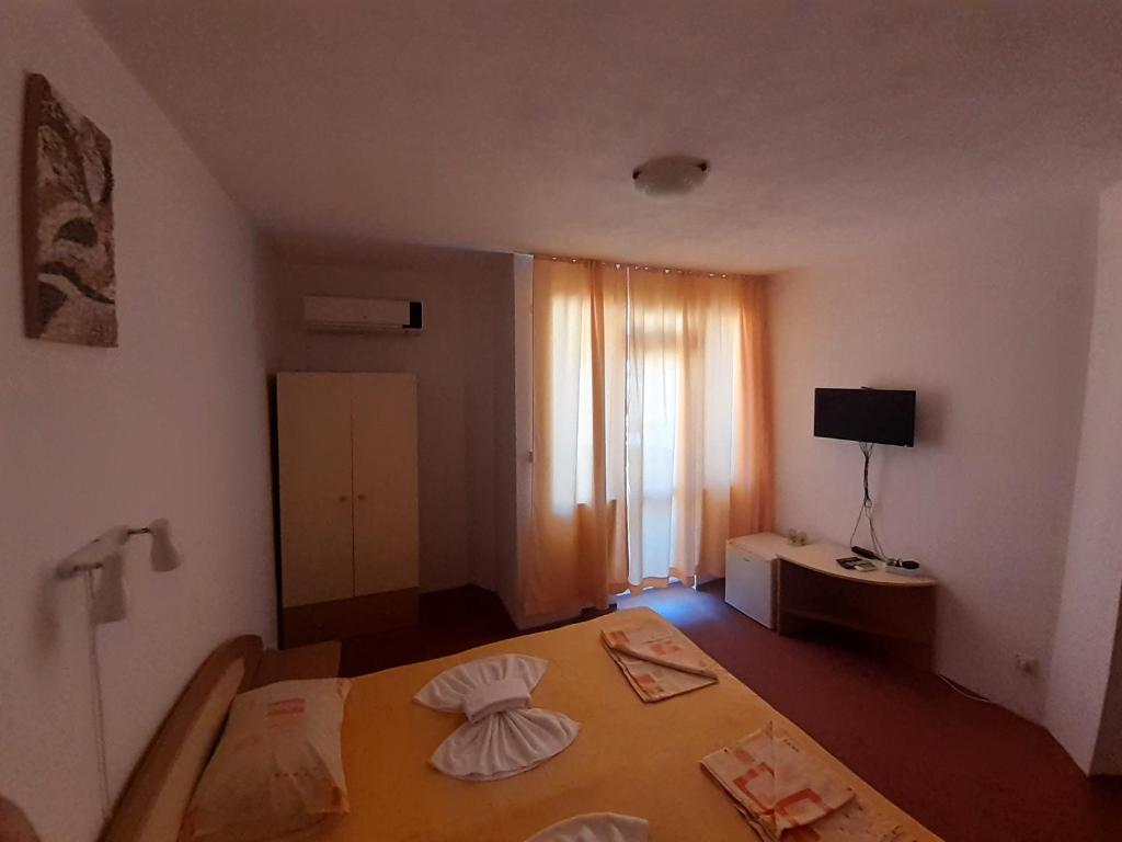 Postel nebo postele na pokoji v ubytování Guest House Malkata Stopanka