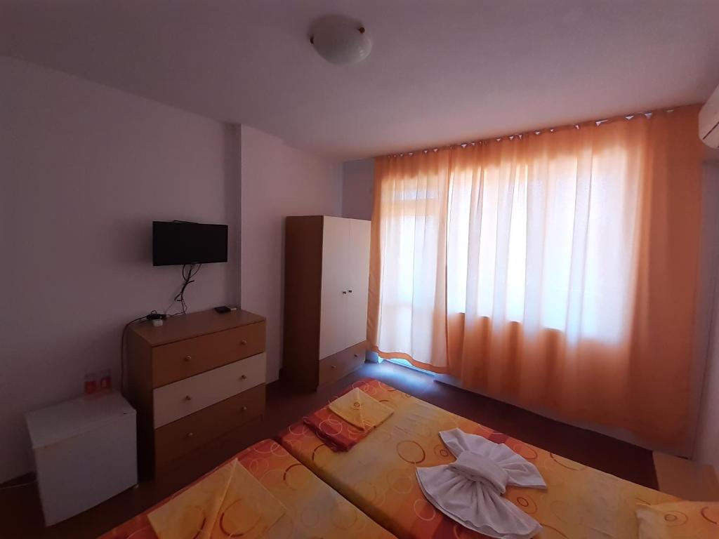 Postel nebo postele na pokoji v ubytování Guest House Malkata Stopanka