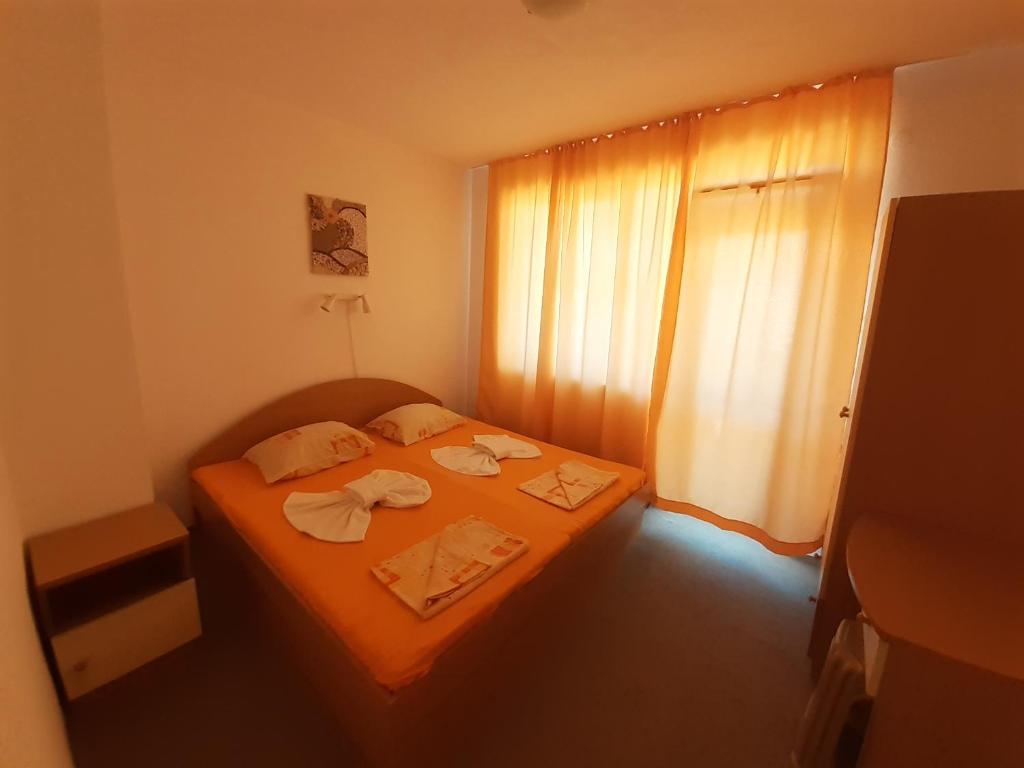 Postel nebo postele na pokoji v ubytování Guest House Malkata Stopanka