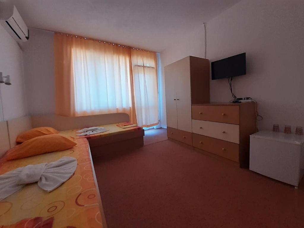 Postel nebo postele na pokoji v ubytování Guest House Malkata Stopanka