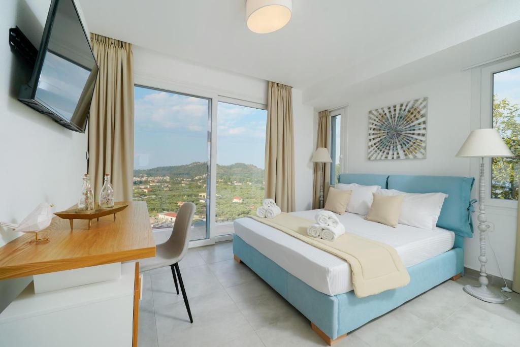 Postel nebo postele na pokoji v ubytování Kefi Luxury Villas