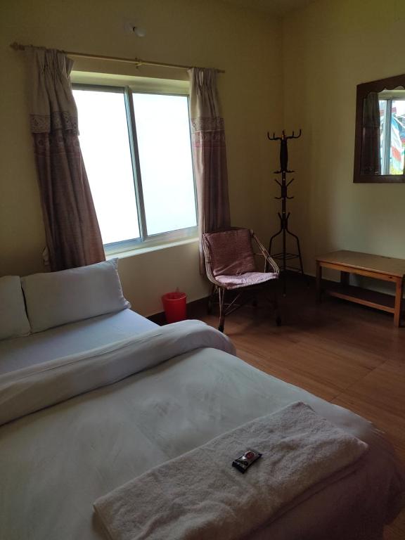 Ein Bett oder Betten in einem Zimmer der Unterkunft Hotel Green Hill View