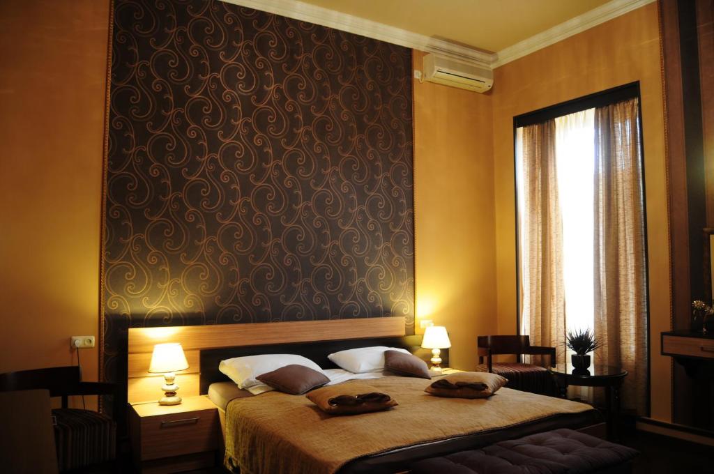 Postel nebo postele na pokoji v ubytování Azoyan Guest House
