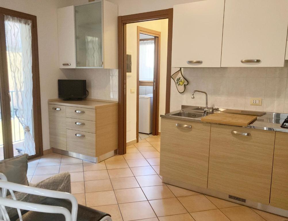 a kitchen with a sink and a counter top at Lovely apartment in center of Barzio in Barzio