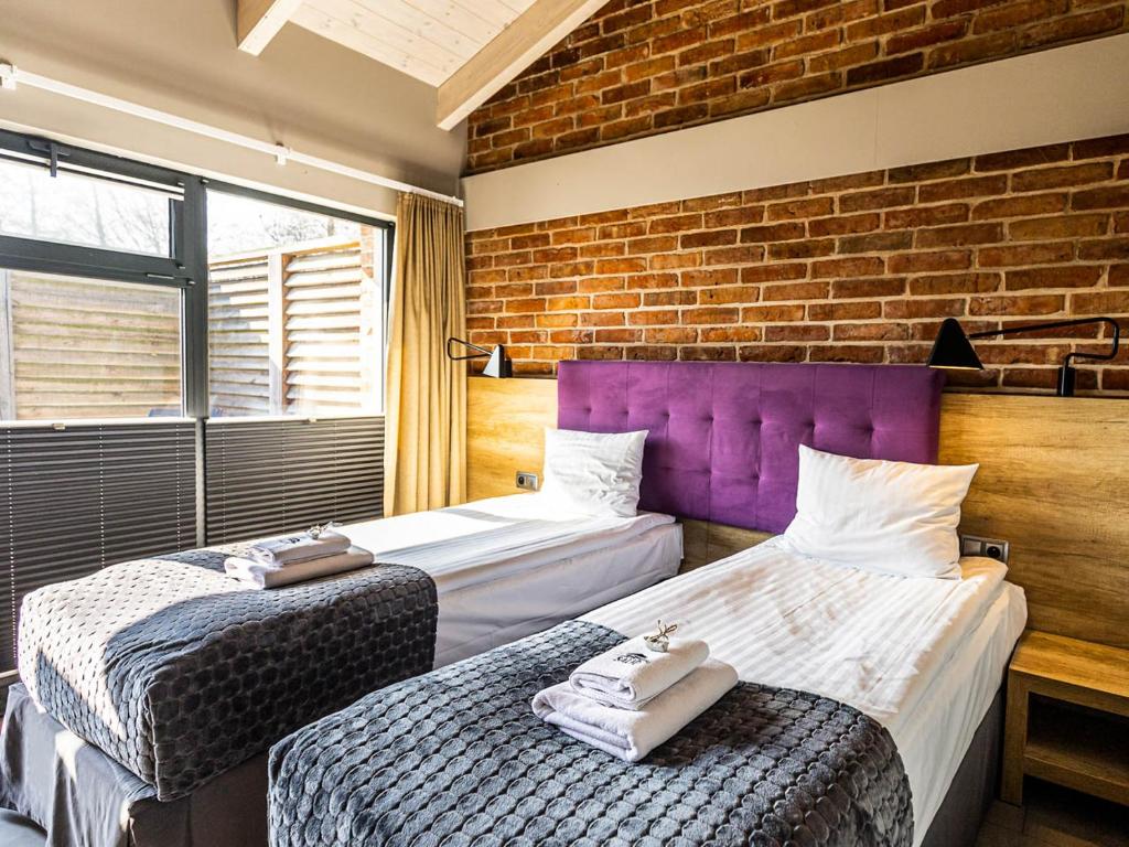 Posteľ alebo postele v izbe v ubytovaní Salio Equisport Resort