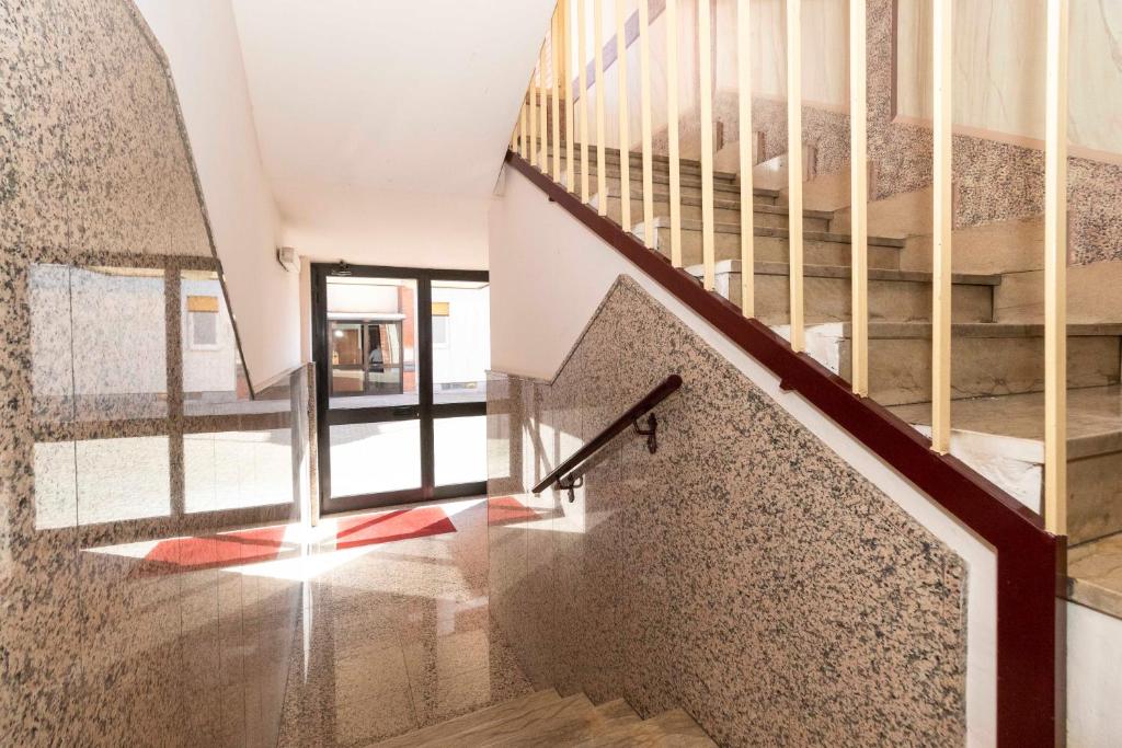 a staircase in a house with a stair case at Angeletti Home in Gassino Torinese