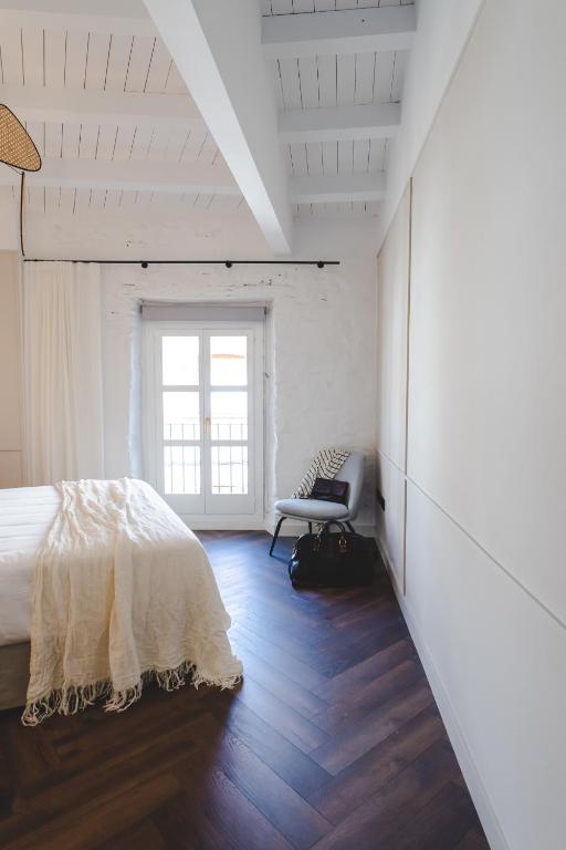 Posteľ alebo postele v izbe v ubytovaní ORA Hotel Priorat, a Member of Design Hotels