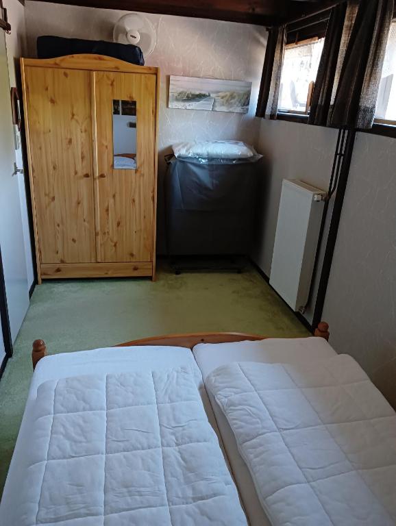 Postel nebo postele na pokoji v ubytování Vakantiehuis Friedeburg