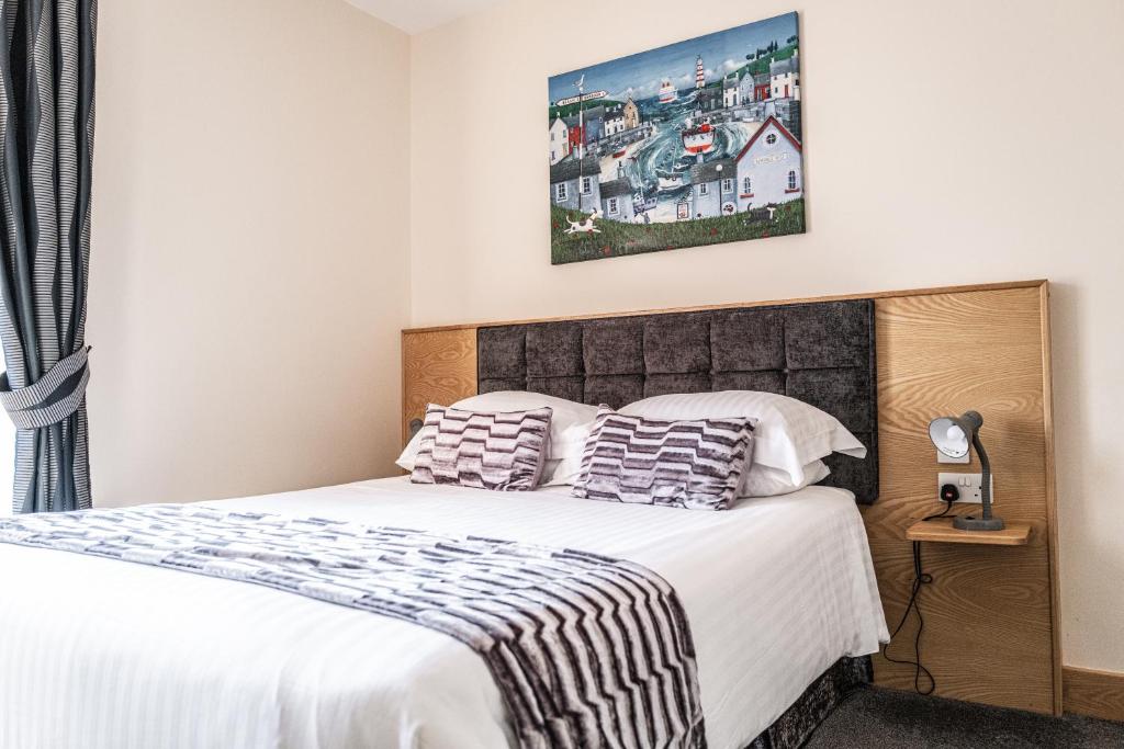 Postel nebo postele na pokoji v ubytování Seaview Hotel