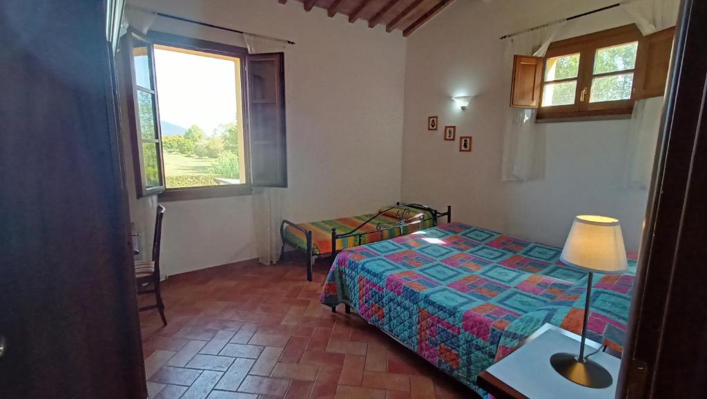 Postel nebo postele na pokoji v ubytování il Chiassetto Agriturismo No Kids