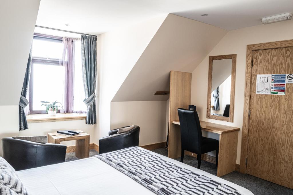 Postel nebo postele na pokoji v ubytování Seaview Hotel