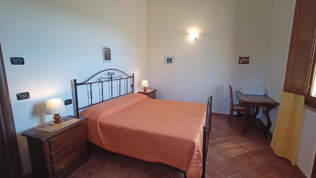 Postel nebo postele na pokoji v ubytování il Chiassetto Agriturismo No Kids