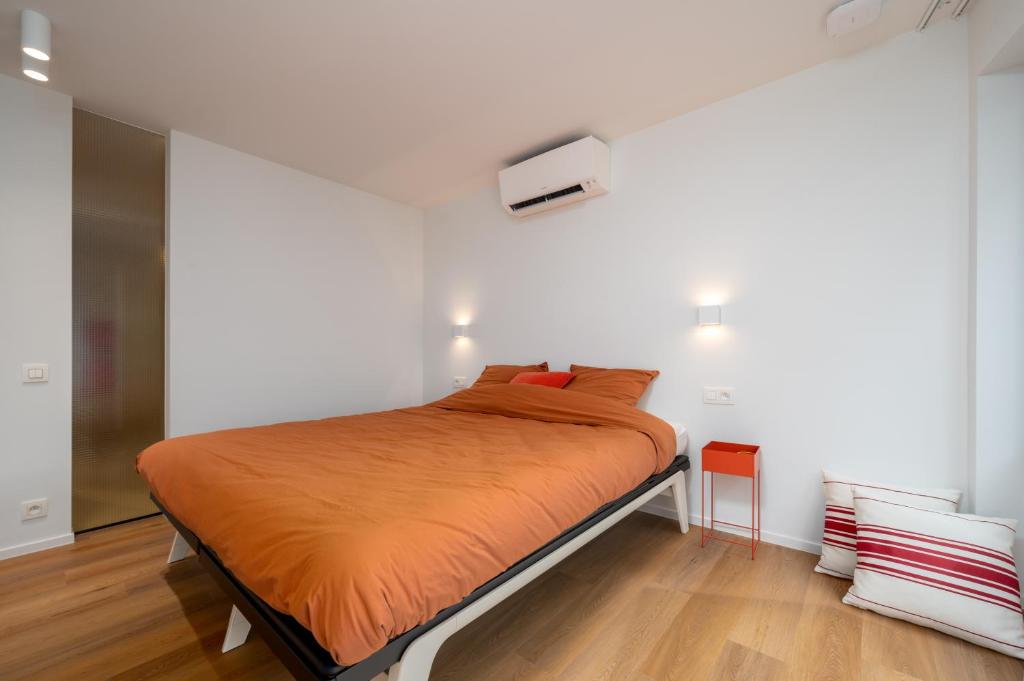 Postel nebo postele na pokoji v ubytování Georges & Madeleine Apartments