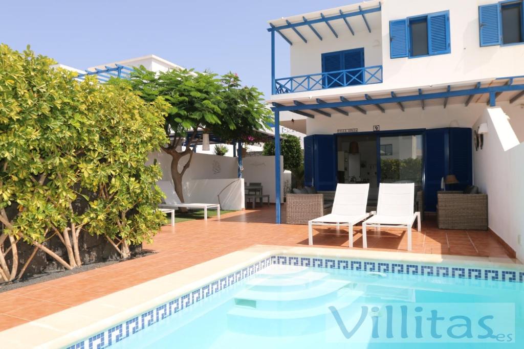 a villa with a swimming pool and a house at VILLA DUNIA by Villitas in Playa Blanca