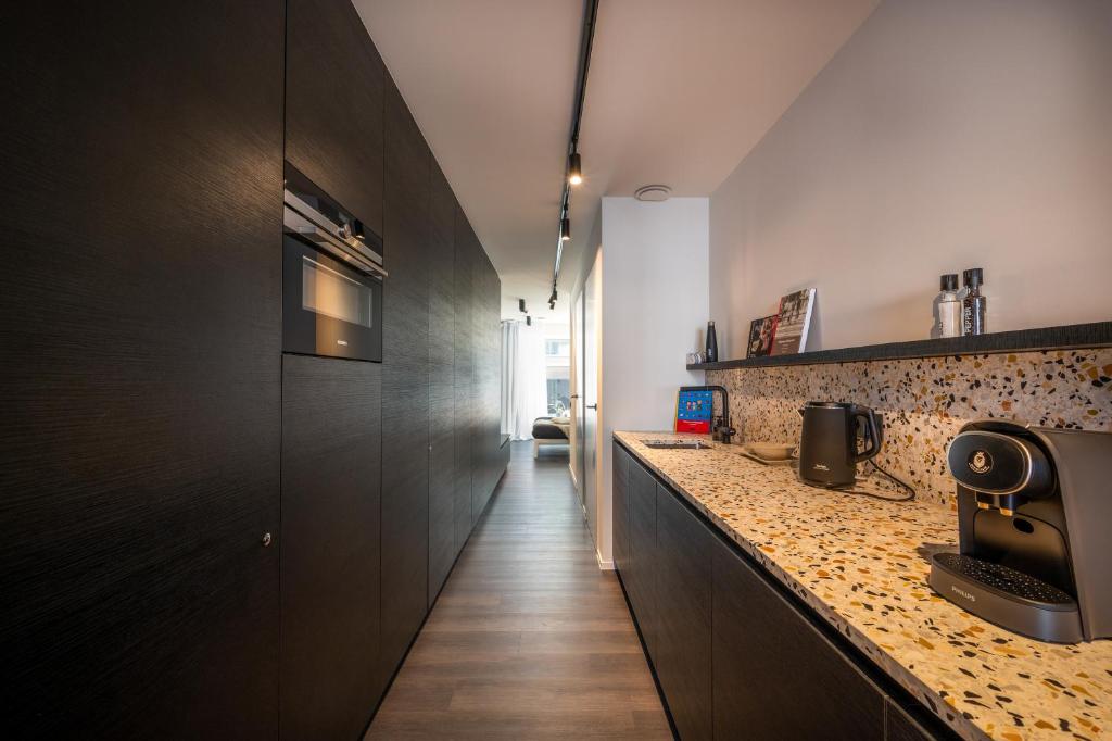 Kuchyň nebo kuchyňský kout v ubytování Georges & Madeleine Apartments