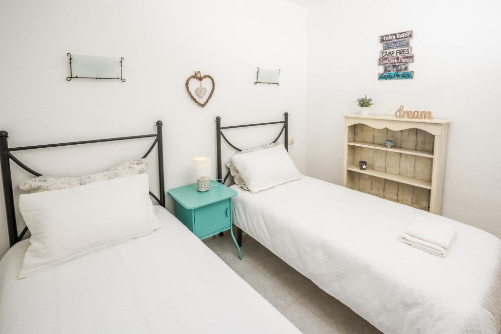 A bed or beds in a room at Casa Frederyk