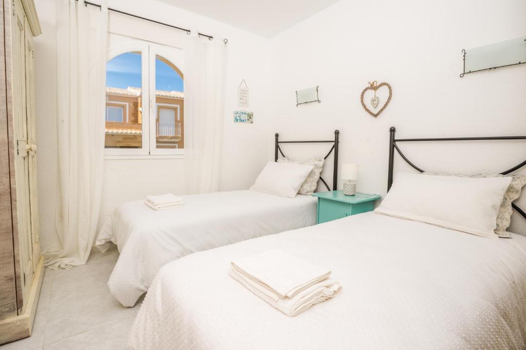 A bed or beds in a room at Casa Frederyk