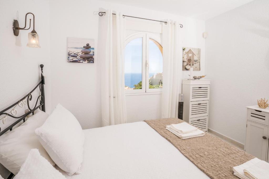 A bed or beds in a room at Casa Frederyk