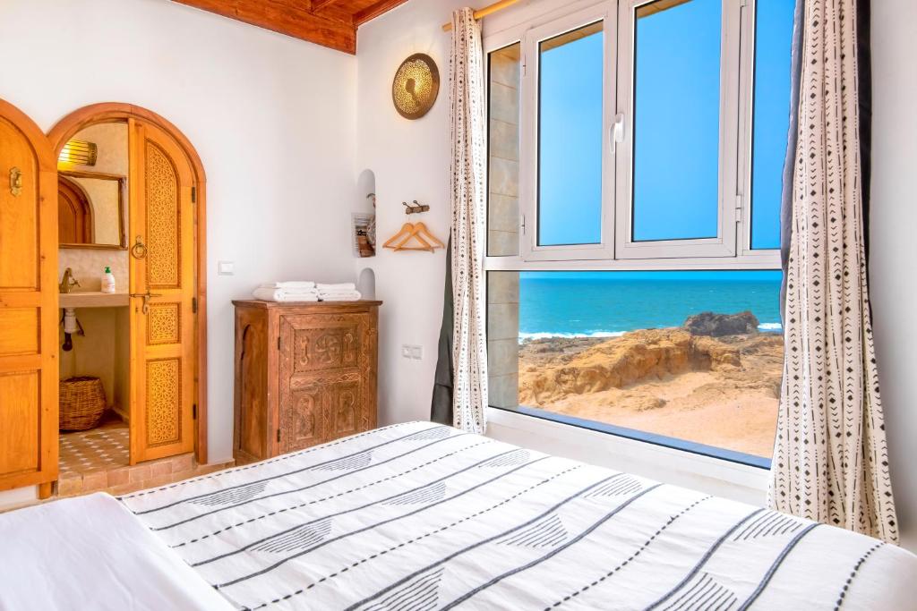Postel nebo postele na pokoji v ubytování Riad Kafila